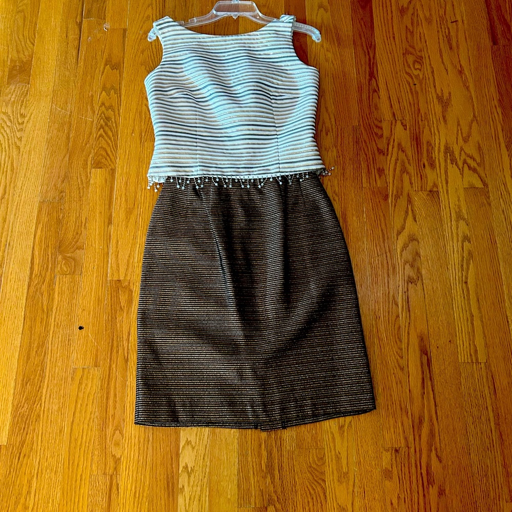 2 piece Cachet size 8 gold lame threads running through top and skirt.